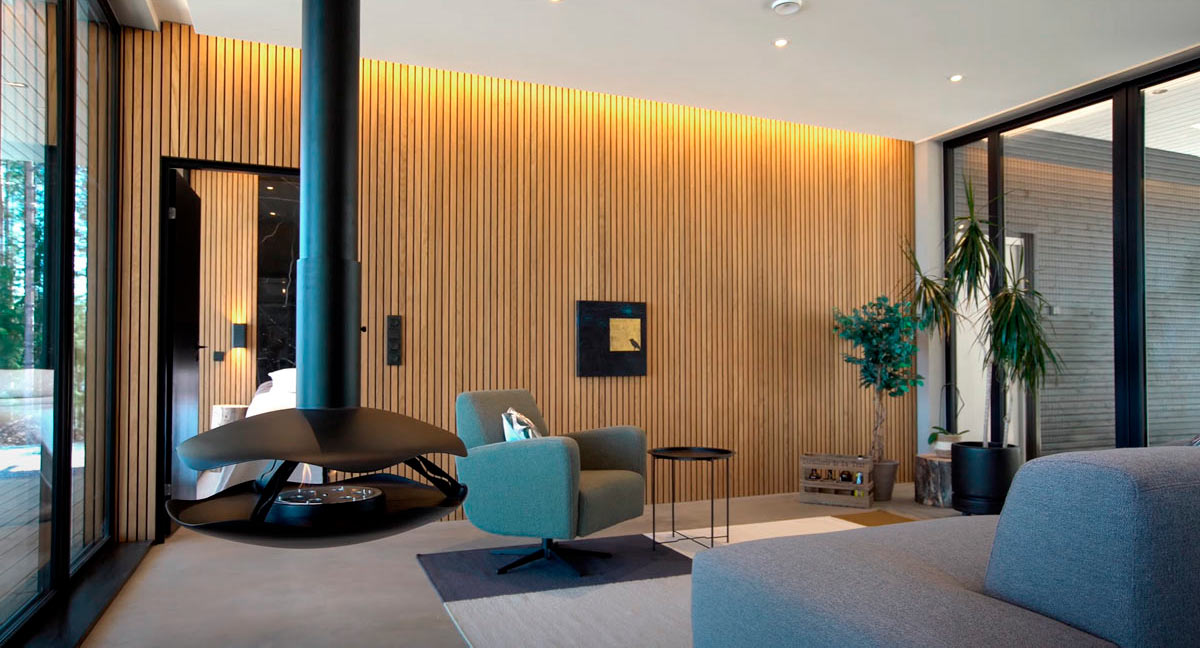 Olohuoneen valaistus modernilla LED-ratkaisulla, epäsuoraa valoa ja tyylikäs sisustus.