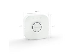Philips Hue Bridge valkoisen keskusyksikön kuva, mitat 90,9 mm x 26 mm x 90,6 mm.